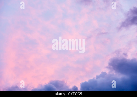 Moody red and blue sky at sunset with copyspace Stock Photo