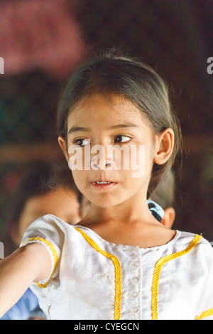 Little Cambodian Girl learning the traditional Cambodian Apsara Dance at a School in Phnom Penh, Cambodia Stock Photo