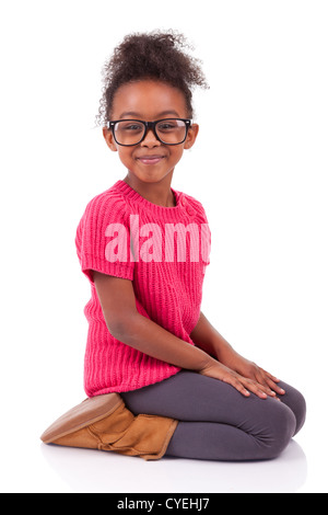 Portrait of a cute young African American girl seated on the floor Stock Photo
