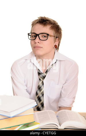 teenager student sits behind a desk isolated on white background Stock Photo