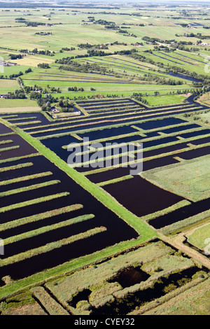 The Netherlands, Spanga, Landscape of water and small strips of land as a result of digging peat. Aerial. Stock Photo