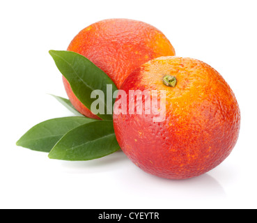 Two red oranges with leafs. Isolated on white background Stock Photo