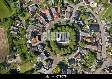 Center of village. Church constructed on mount. Formerly people could escape to the church in times of flooding. Aerial. Stock Photo