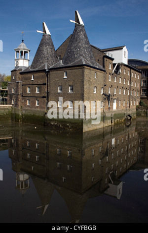 The Clock Mill at Three Mills in Bow with water reflection, Lee Valley, England Stock Photo