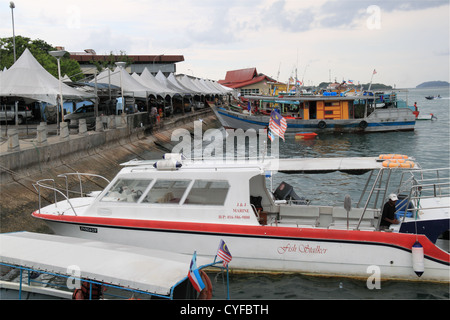 Fishing boats moored by the Central Market on the waterfront, Kota Kinabalu, Sabah, Borneo, Malaysia, Southeast Asia Stock Photo
