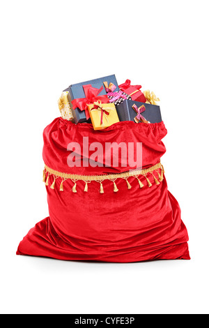 Santa's bag full of Christmas presents isolated against white background Stock Photo
