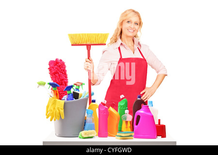 A female cleaner posing with cleaning equipment isolated against white background Stock Photo