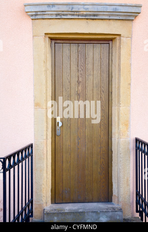 Vew of a modern wooden door in old facade, city Luxembourg/Luxembourg, summer Stock Photo