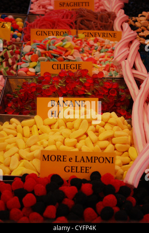 Colorful candies on stand for sale at market, Italy Stock Photo