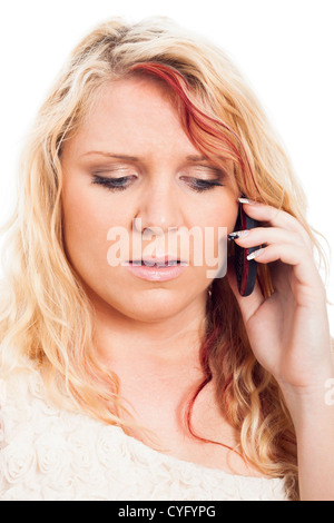Close up of young blond worried woman on the phone. Stock Photo