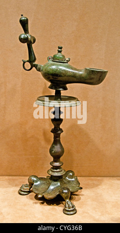 Standing bronze oil lamp with a Christian cross finial handle on a baluster pricket stand, Byzantine, 5th century AD, Syria. Stock Photo