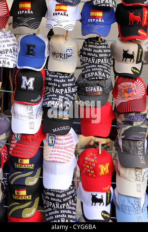 Brightly colored baseball caps for sale, El Rastro, Sunday street market, Madrid, Spain, Espana. Stock Photo