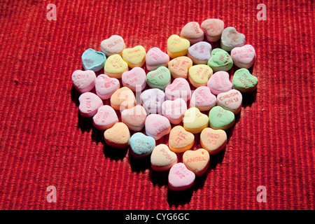 conversation hearts in a large heart shape Stock Photo