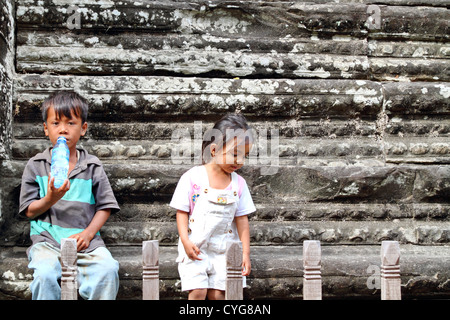 Little Children in the Temple of Angkor Wat, Cambodia Stock Photo