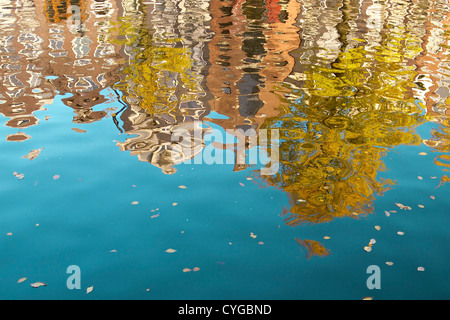 Dutch house reflections on water in Amsterdam city. Stock Photo