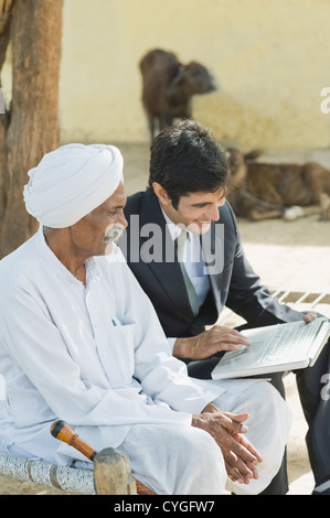 Financial advisor explaining to a farmer about agriculture loan Stock Photo