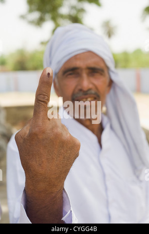 Farmer showing his finger with voting mark Stock Photo