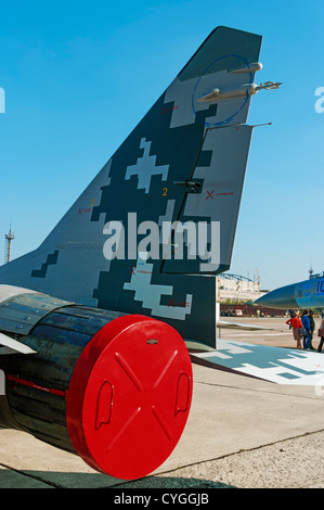 Camouflage and stencils on the tail of  fighter MiG-29 - right vertical stabilizer painting. Stock Photo