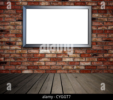 Blank billboard on brick wall in old interior. Place for advertisement. Stock Photo
