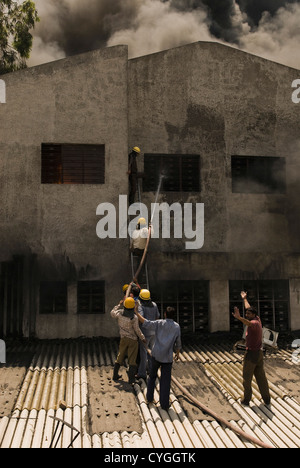 Firefighters during a rescue operation, Gurgaon, Haryana, India Stock Photo