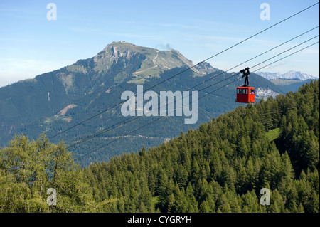 A cableway is bringing tourists up the zwolferhorn mountain near the city of st.Gilgen in Austria Stock Photo