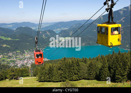 A cableway is bringing tourists up the zwolferhorn mountain near the city of st.Gilgen in Austria Stock Photo