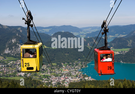 A cableway is bringing tourists up the zwolferhorn mountain near the city of st.Gilgen in Austria Stock Photo