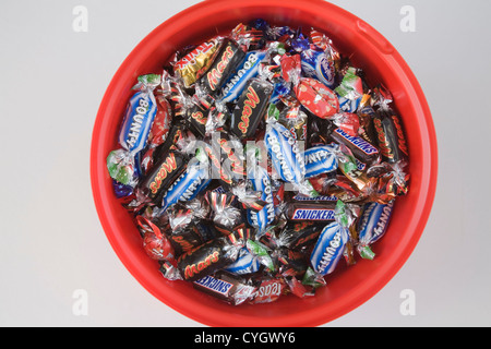 Studio Plastic container filled variety fun size chocolate bars Stock Photo