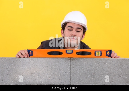Tradesman using a bubble level Stock Photo