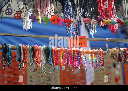 Cheap colorful fun jewelry for sale 2.5 Euro, street market stall El Rastro, Madrid, Spain Stock Photo