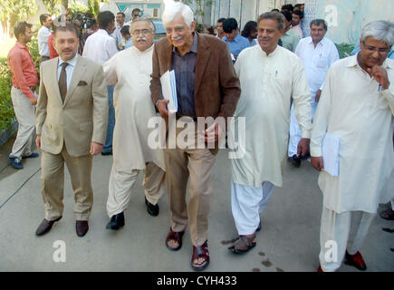 Federal Law Minister, Mola Bux Chandio, Senator (R) Taj  Haider and Sindh Information Minister, Sharjeel Memon comes out from Election Commission  of Pakistan (ECP) office after making a complaint against Peoples Party (PPP) MNA Zafar Ali  Shah and Leader of National Peoples Party (NPP) Murtaza Jatoi, in Karachi on Monday,  November 05, 2012. Stock Photo