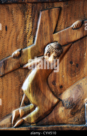 wooden way of the cross: Jesus Christ carry the cross. In a roman catholic chapel in Namibia Stock Photo