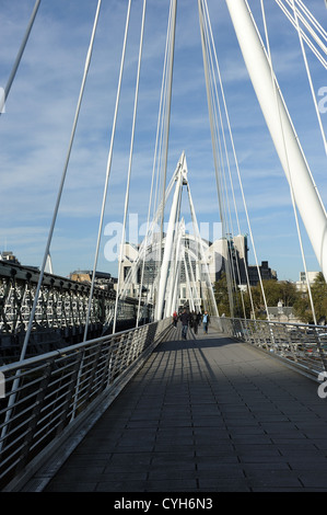 Hungerford footbridge across the road from, Embankment Underground.  London. Stock Photo