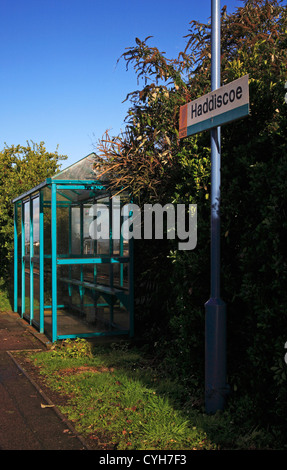 A passenger shelter and rail station sign at Haddiscoe, Norfolk, England, United Kingdom. Stock Photo