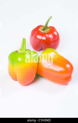 Three sweet peppers isolated on a white background. Stock Photo