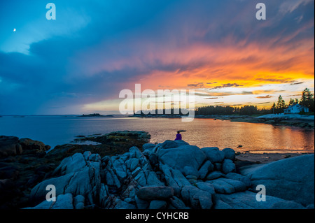 Sunset on the rocky terrain of Deer Isle, Maine Stock Photo