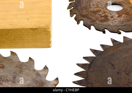 three circular saw disks parts with different blades and plank wooden board closeup isolated on white bakcgound Stock Photo