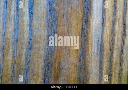 Background of blurred brown wood imitation furniture texture. Stock Photo