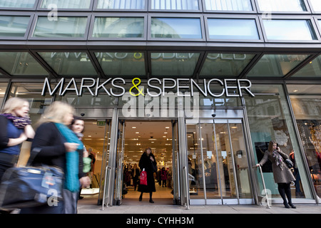 London, UK. 5/11/2012. (Pictured) People walking pass a Mark & Spencer store entrance in London ,Peter Barbe / Alamy Stock Photo