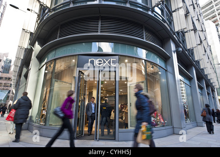 London, UK. 5/11/2012. (Pictured) People walking pass a NEXT retailer clothing store in London .Peter Barbe / Alamy Stock Photo