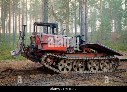 Old rusty all-terrain vehicle on tracks Stock Photo