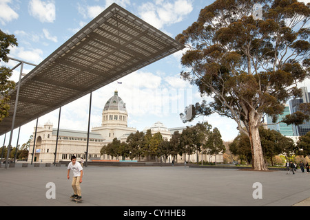 Carlton gardens and the museum Melbourne Australia on a sunny day at exhibition center. skate boarder Stock Photo