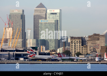 Regional airliners at London City Airport. Canary Wharf and O2 in the background, England, UK Stock Photo