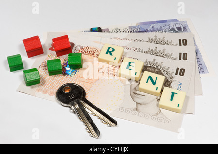 British Sterling notes and game tiles spelling the word Rent along with toy wooden houses and a pair of silver yale style keys