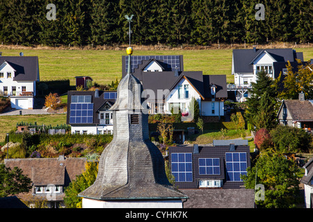 Solar panels on a roof of private houses. Solar thermal energy. Stock Photo