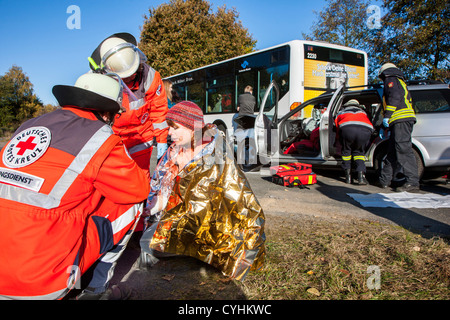 Car crash accident exercise of rescue teams, Red Cross, fire brigade, police. Stock Photo