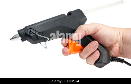 Electric hot glue gun in hand isolated on a white background. Stock Photo