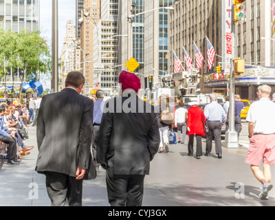 International Businessmen Walk Along Crowds,  6th Avenue, NYC Stock Photo