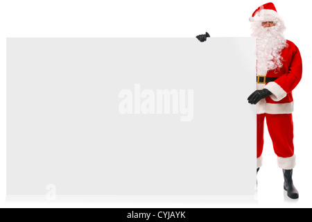 Full length photo of Santa Claus holding a large blank sign Stock Photo