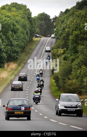 A group of weekend bikers on the Fosse Way road in Gloucestershire UK Stock Photo